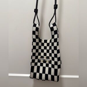 Last frame black and white checkered mini crossbody bag